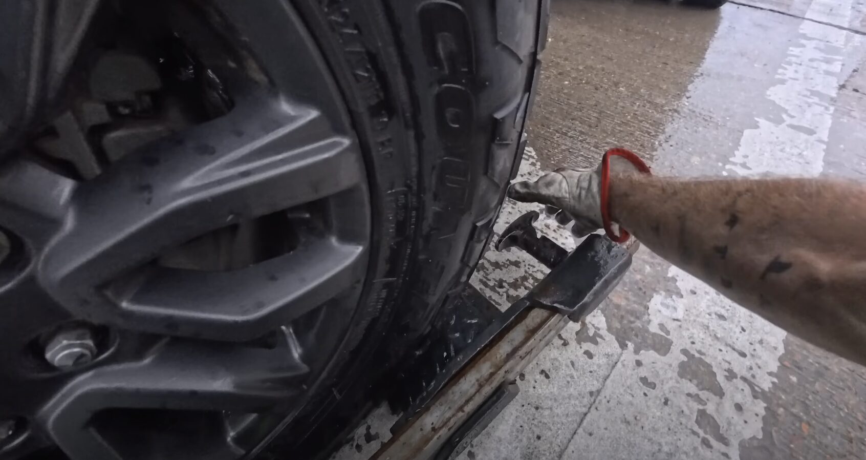 Professional technician securing vehicle during roadside assistance