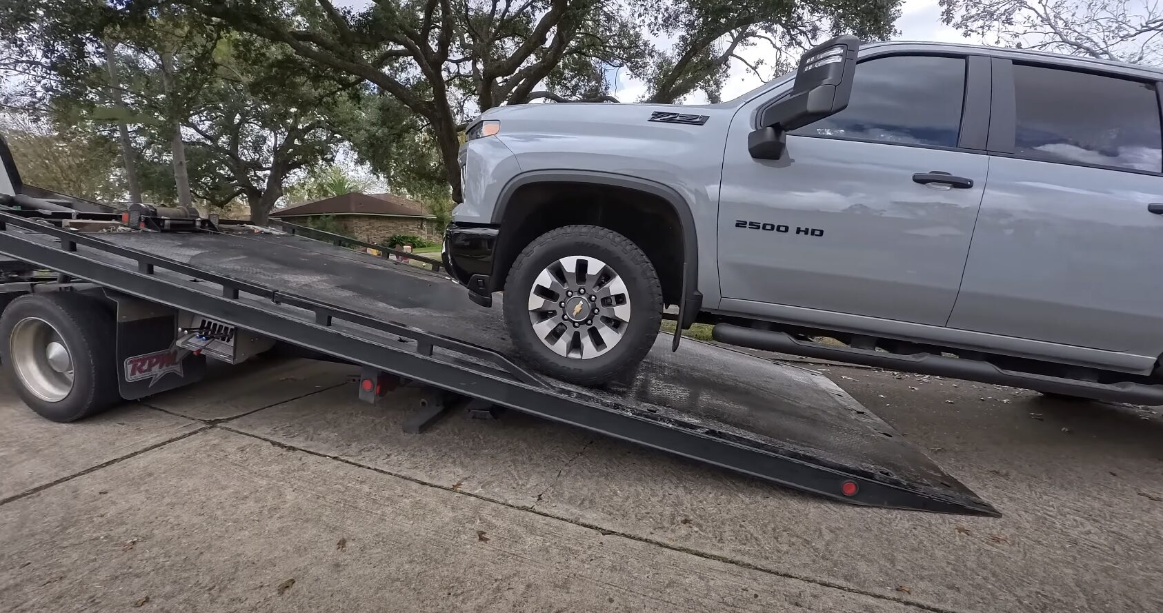 Professional tow truck loading a vehicle in Edina, MN