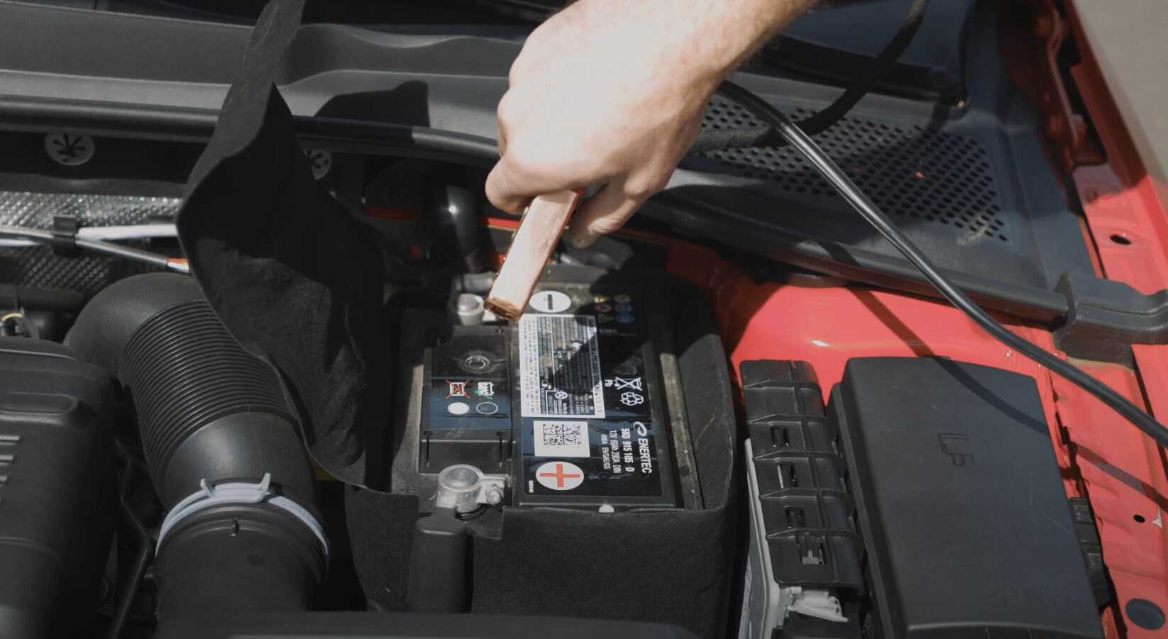 Vehicle breakdown showing car battery and engine components
